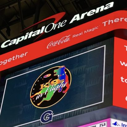 Electronic scoreboard at Capital One Arena displaying Coca-Cola branding and a colorful 'Kings in Flight' logo.