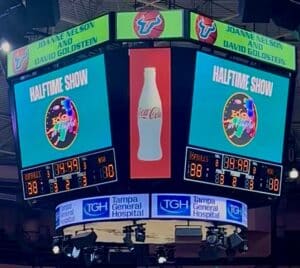 Arena scoreboard showing the halftime show graphic